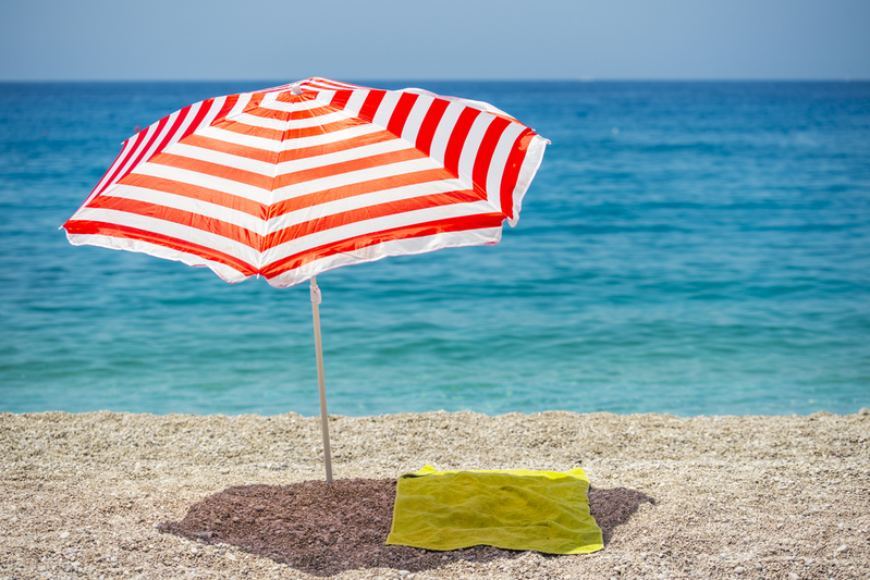 striped umbrella on beach