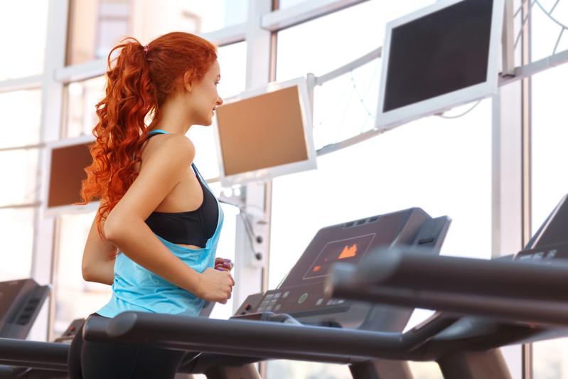 woman running on treadmill