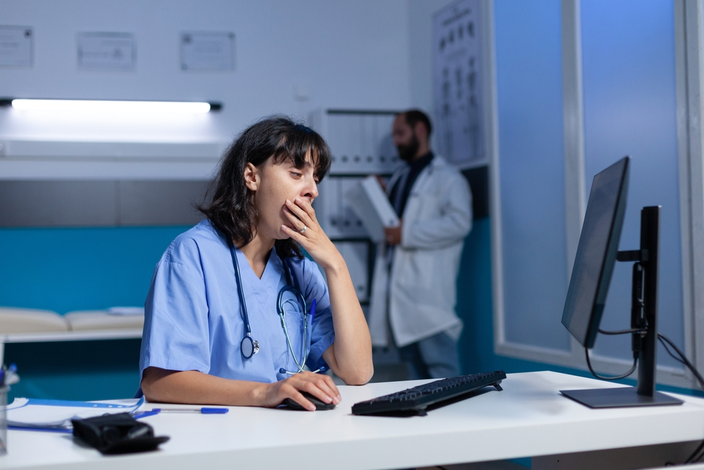 tired nurse working late